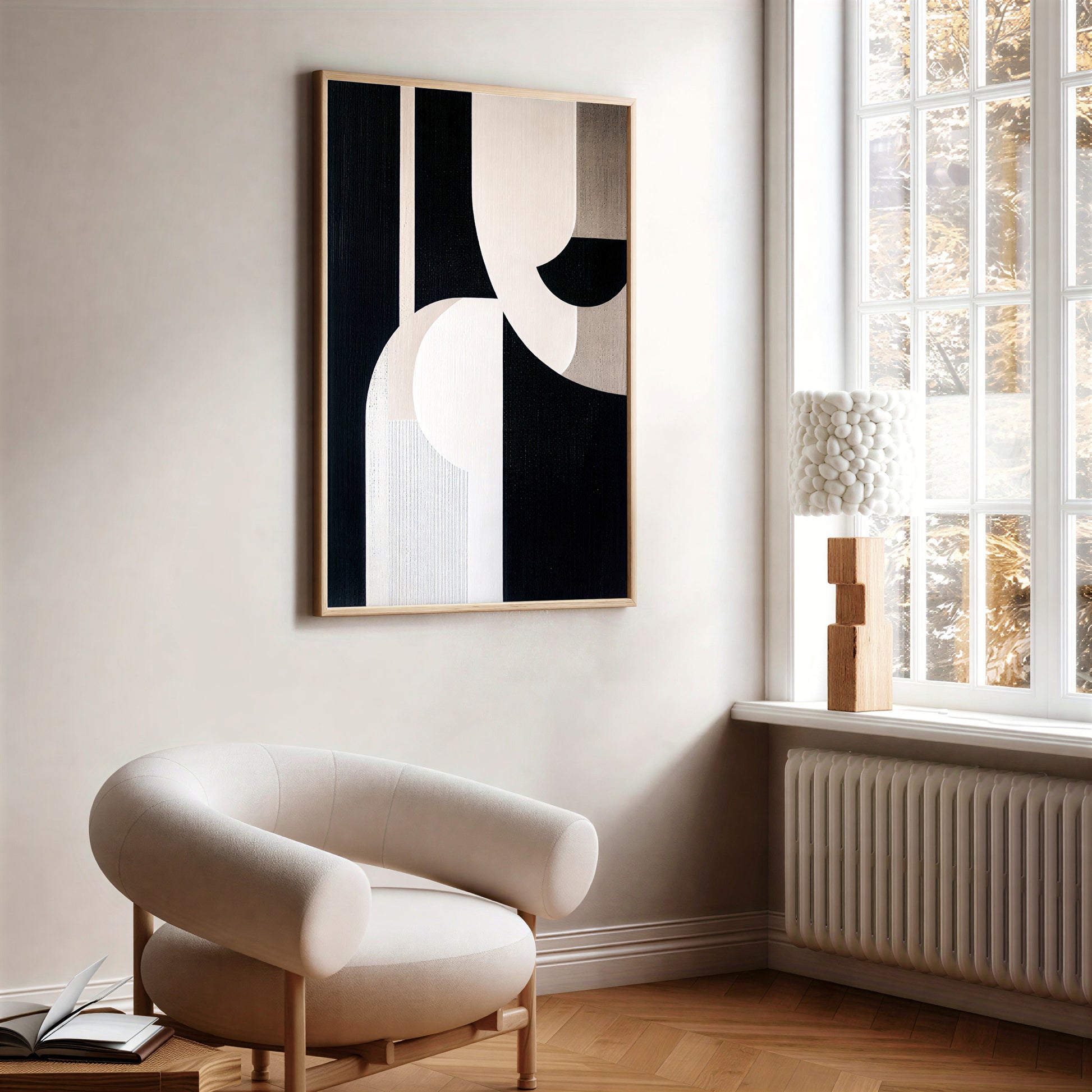 Modern interior with abstract art on the wall and a chair near a window.