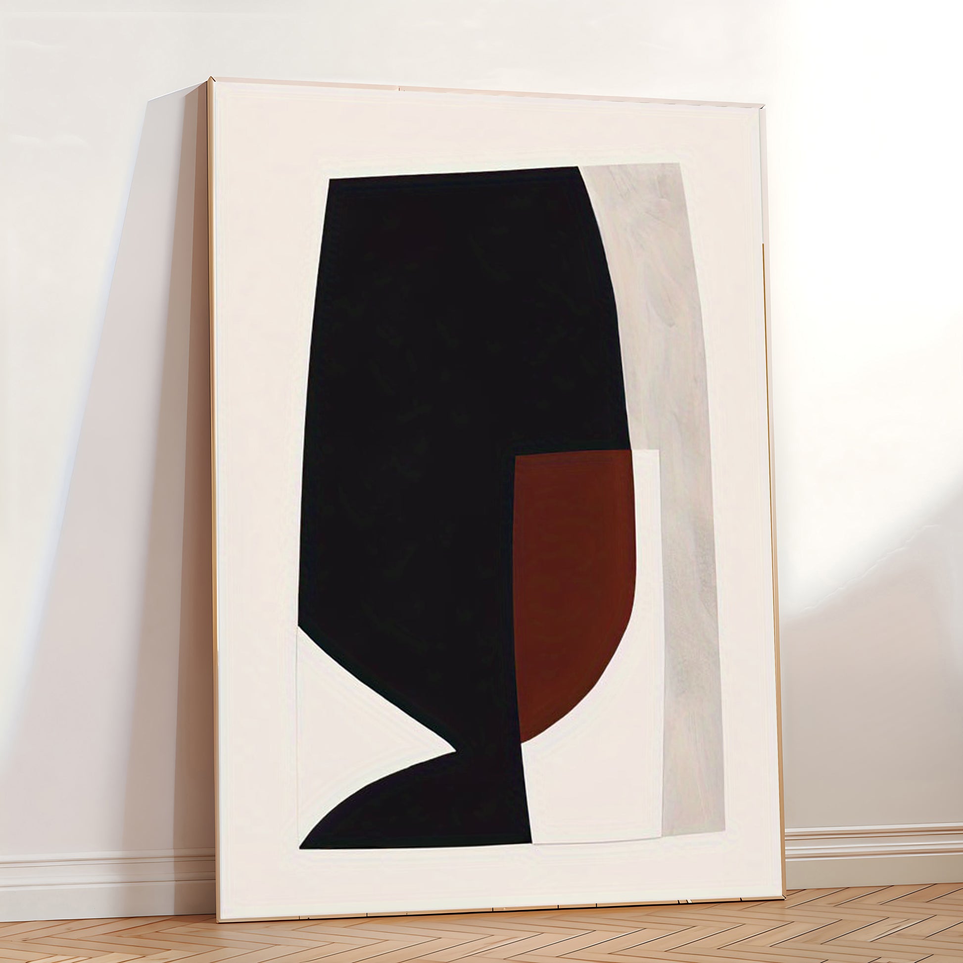 Abstract art piece with black and brown shapes on a white background