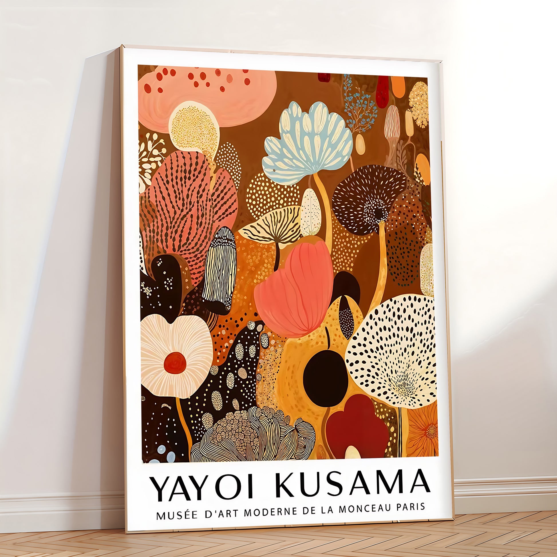 Framed Yayoi Kusama artwork with abstract floral design on a wall.
