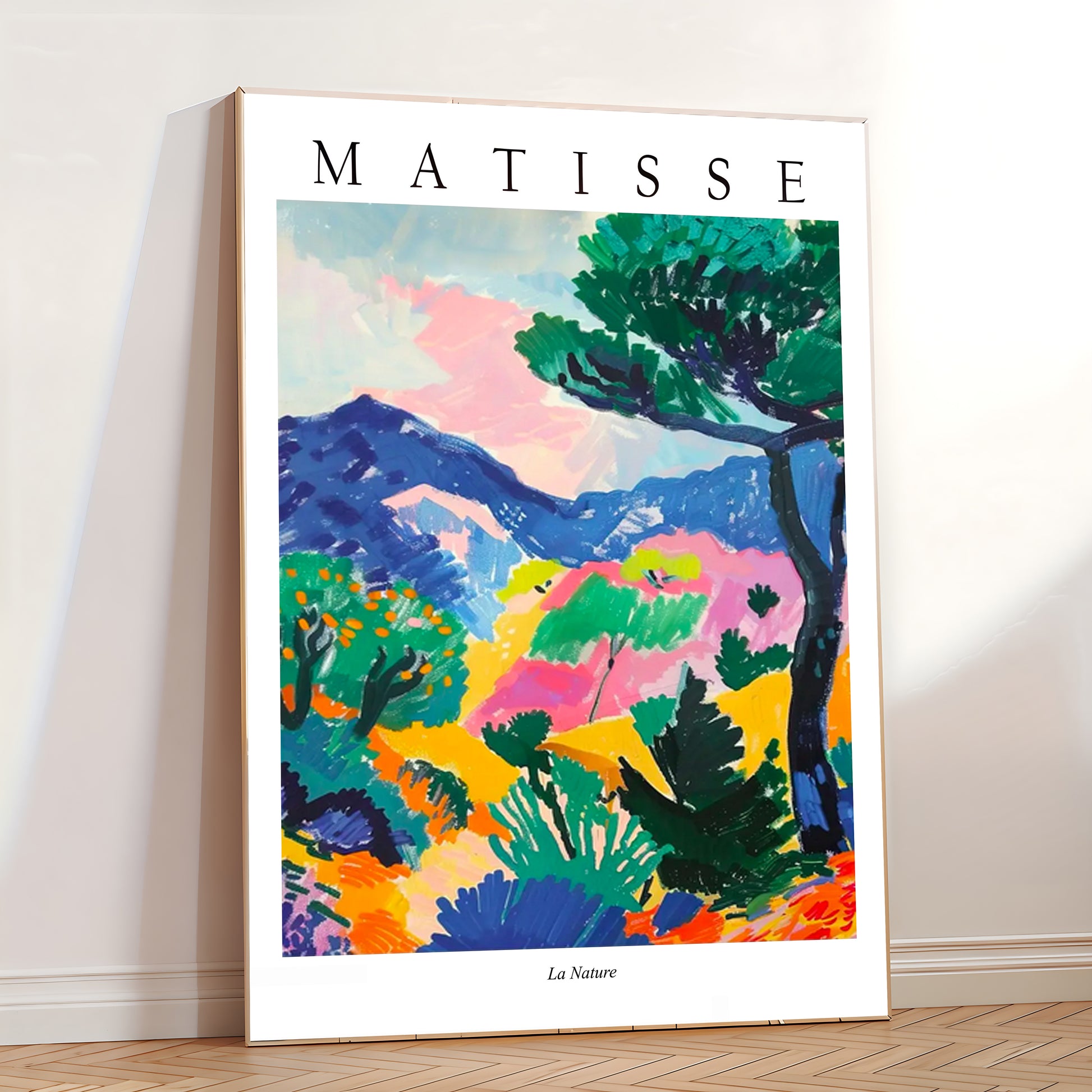 Framed Matisse artwork with colorful abstract design on a white wall.