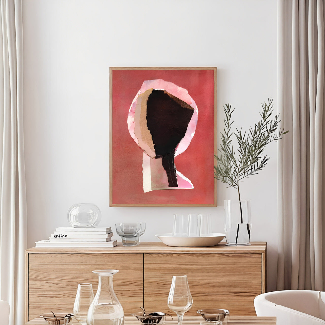 Modern interior with a wooden cabinet, abstract art, and decorative items.