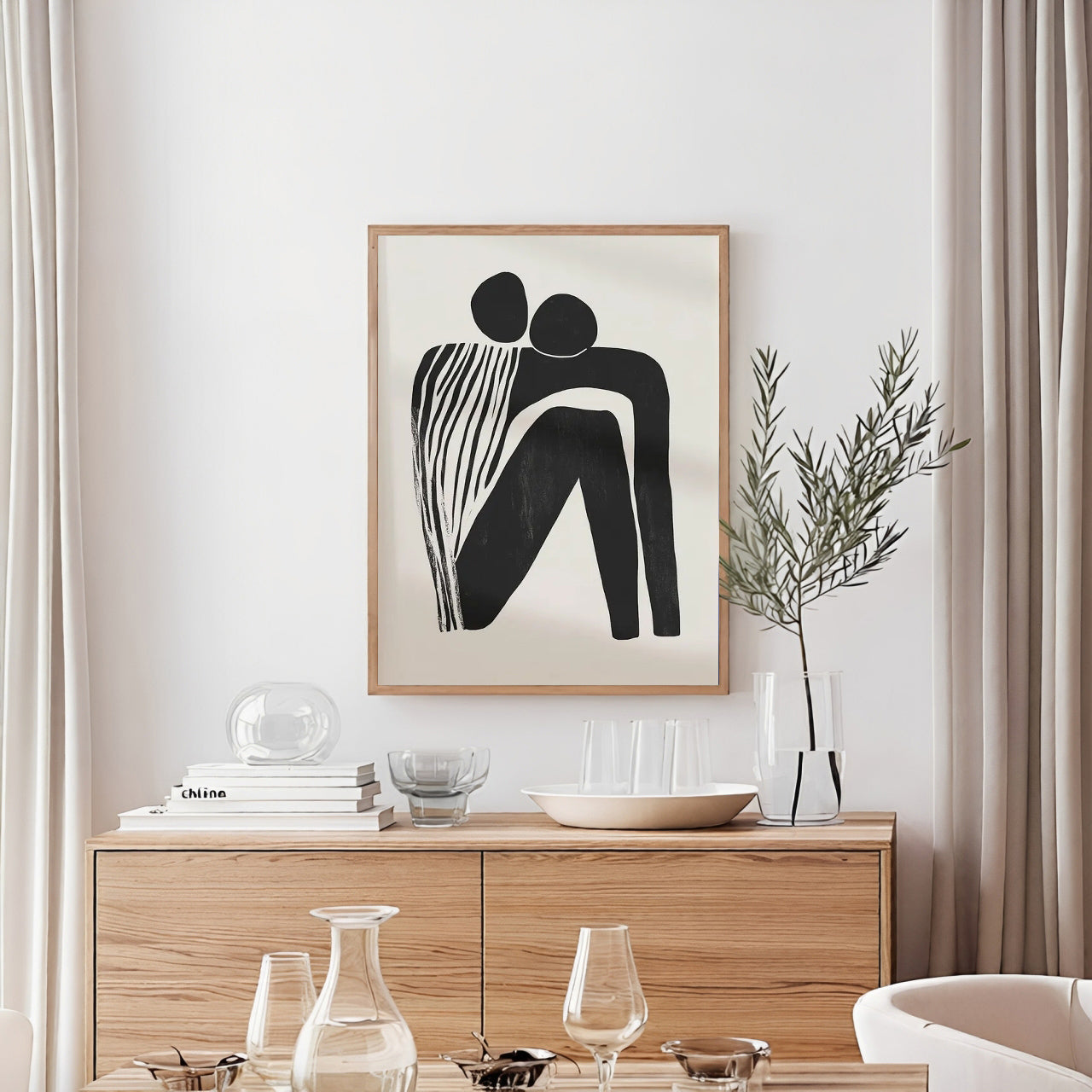 Modern interior with a wooden cabinet, abstract art, and decorative items.