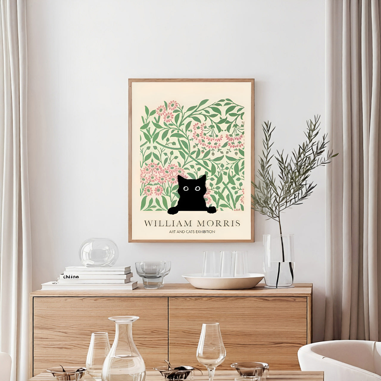 Framed artwork with a black cat and floral design on a wall above a wooden cabinet.
