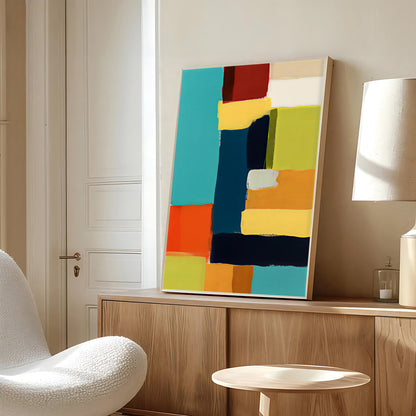 Colorful abstract painting on a wooden shelf in a room with a white chair and lamp.