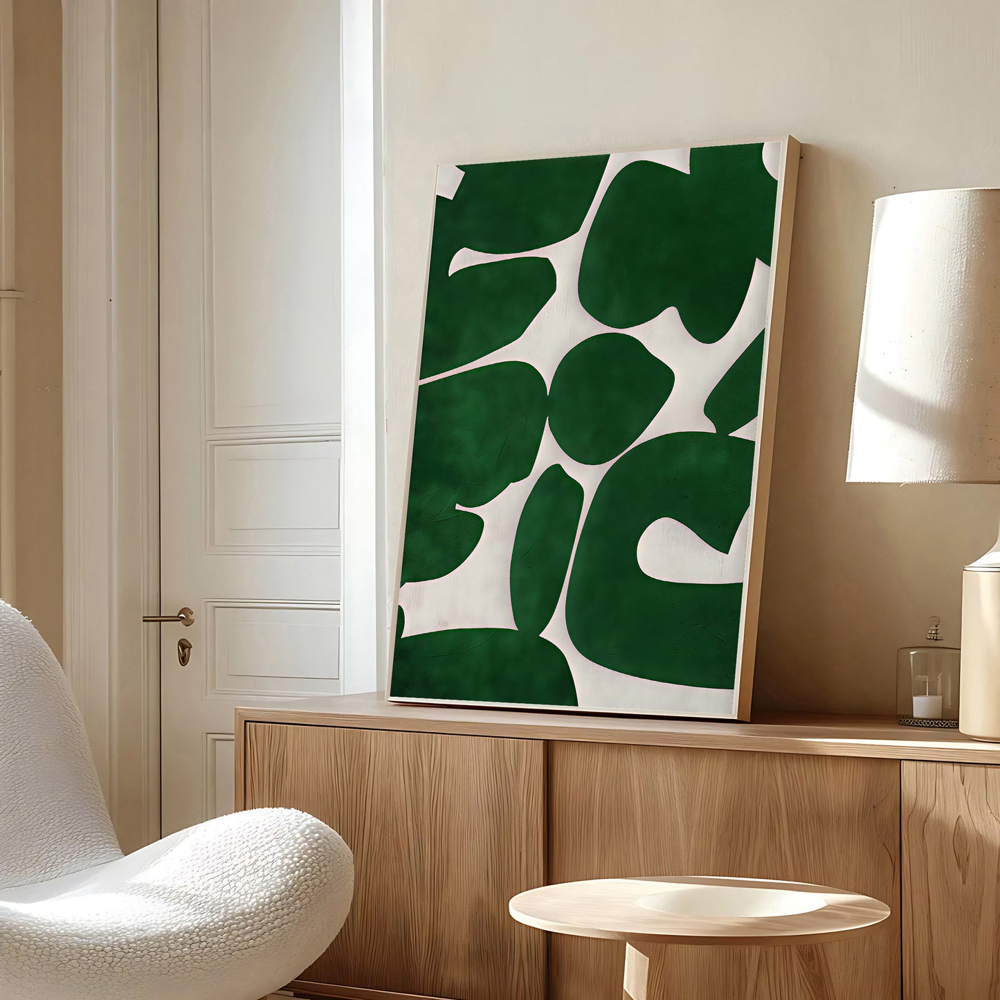 Modern interior with a green abstract painting on a wooden cabinet.