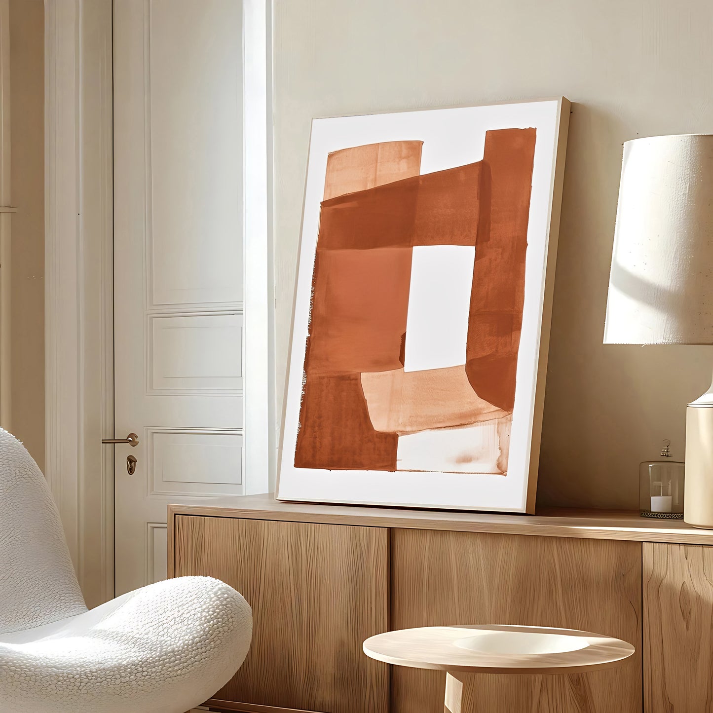 Abstract art piece on a wooden shelf in a room with a chair and lamp.