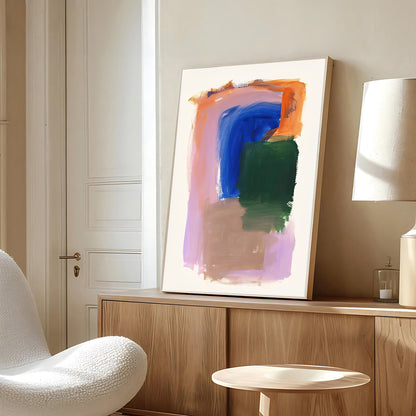 Abstract painting on a wooden shelf with a modern chair and lamp in a room.