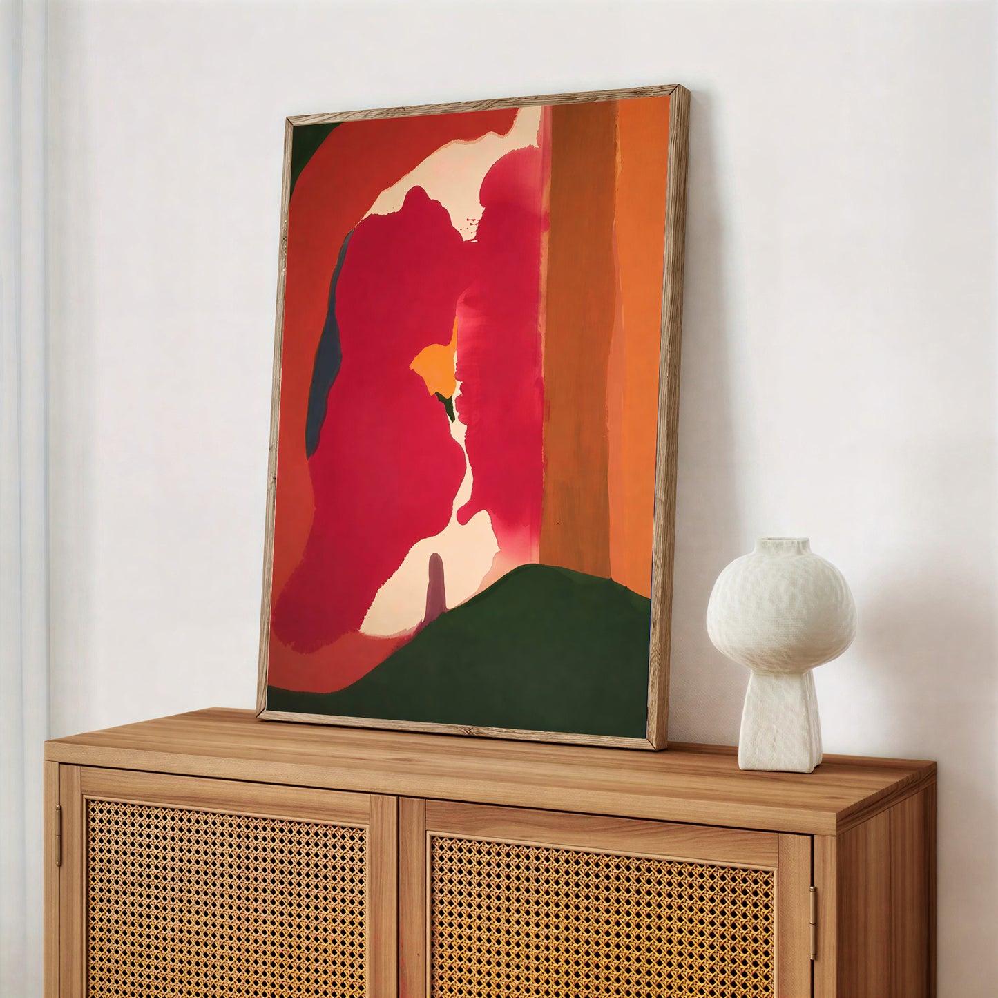 Abstract painting on a wooden cabinet with a white wall background