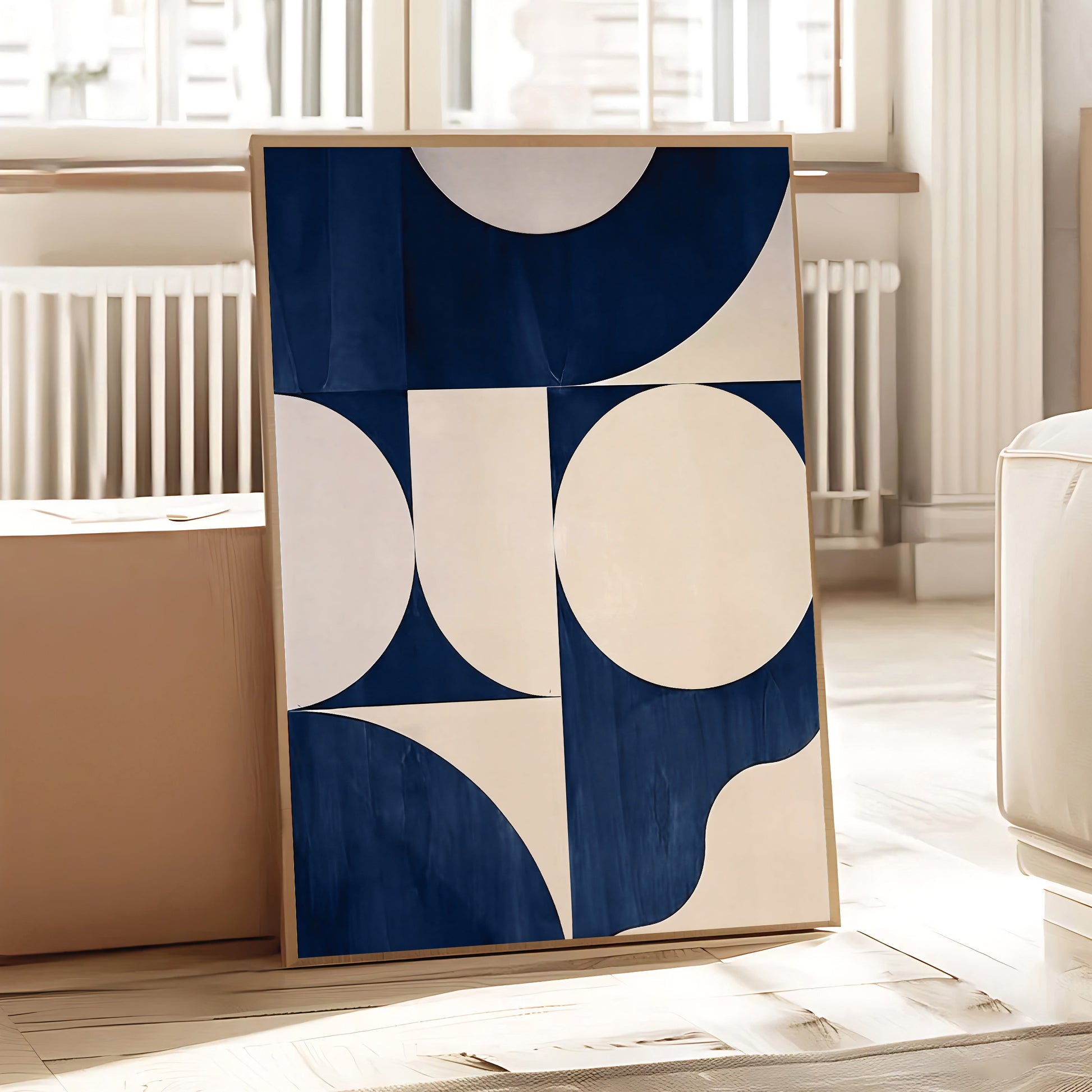 Abstract art print with blue and beige circles in a minimalistic room.