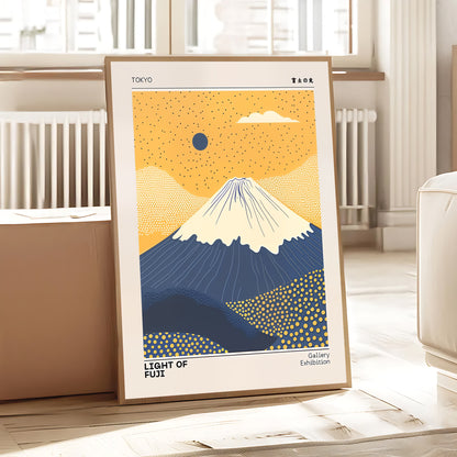 Framed artwork of Mount Fuji with a yellow sky and blue mountain in a room setting.