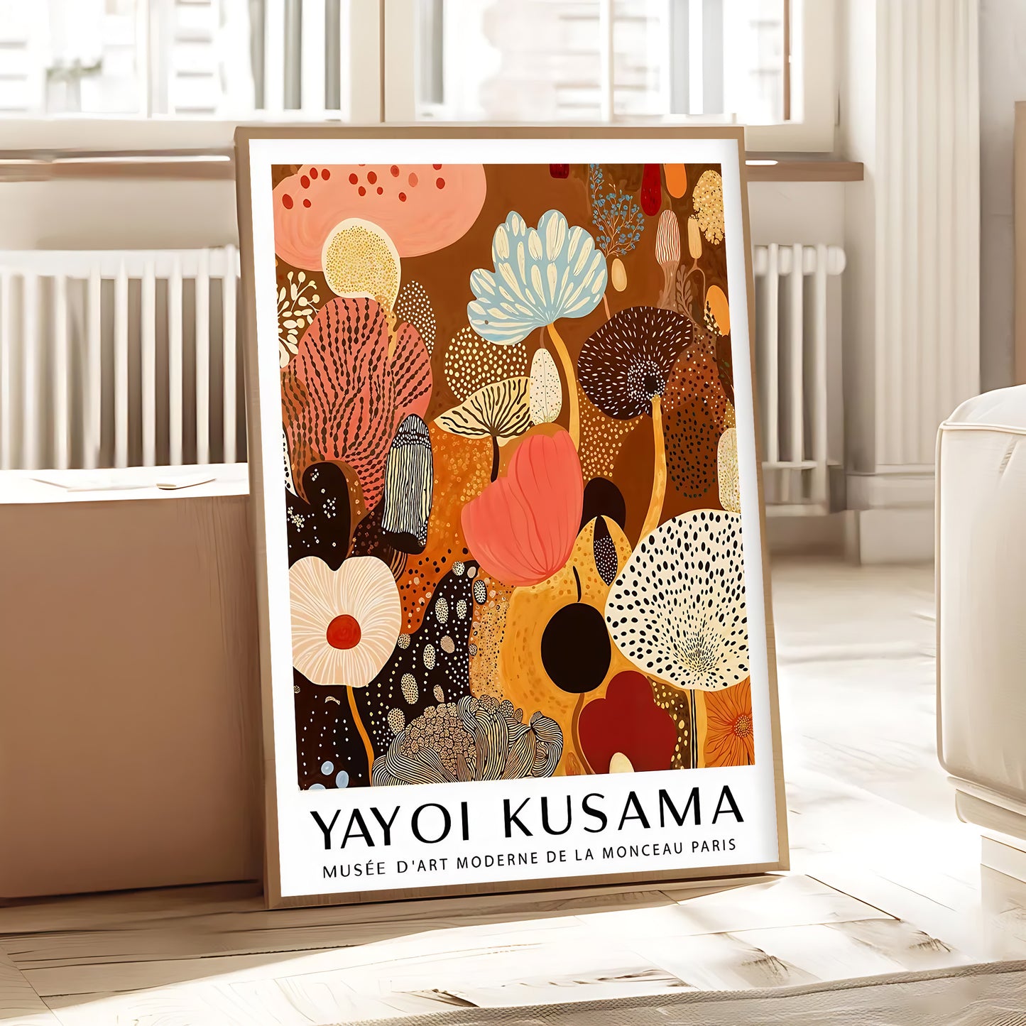 Framed Yayoi Kusama artwork in a room with a radiator and window blinds.