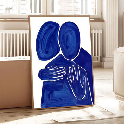 Abstract art piece with blue and white shapes on a white background, framed in a room.