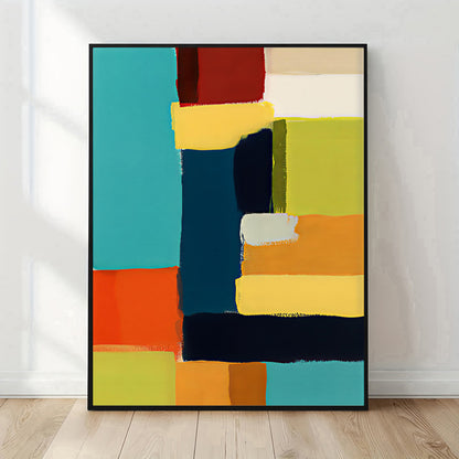 Abstract art print with colorful geometric shapes on a white wall.