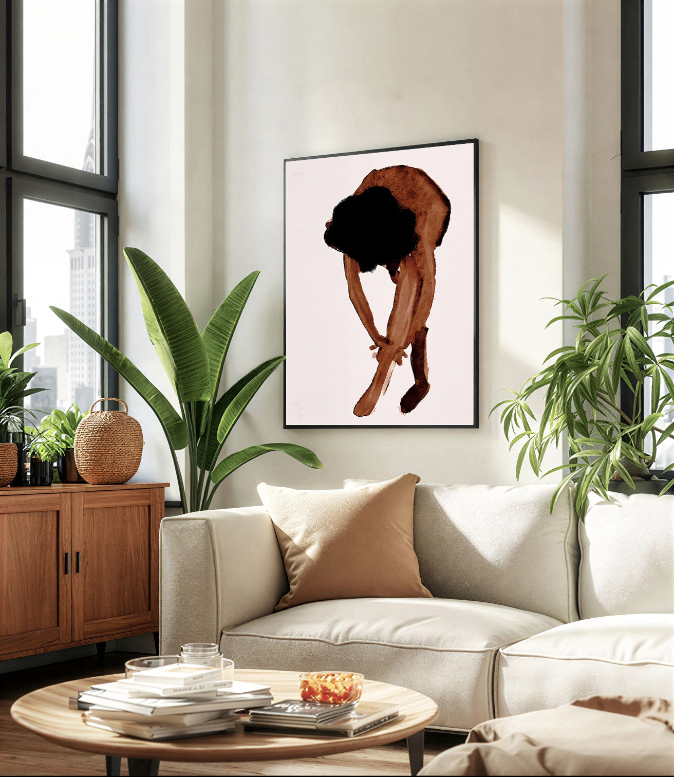 Modern living room with a beige sofa, coffee table, and decorative plants.