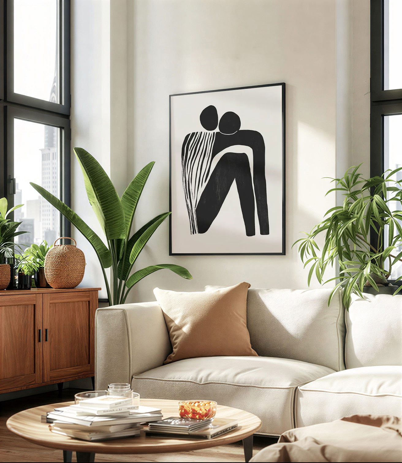 Modern living room with a beige sofa, round wooden coffee table, and abstract art on the wall.