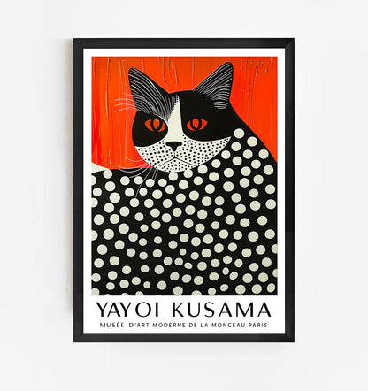 Modern Yayoi Kusama cat art print with black frame on white wall, featuring bold orange background and black-and-white polka dot design, contemporary minimalist wall decor