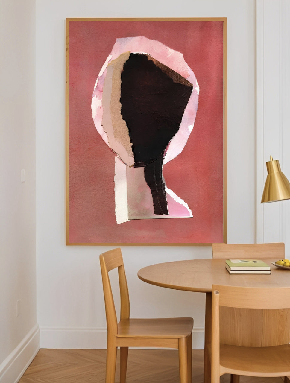 Dining room with a round table and chairs, and a large abstract painting on the wall.