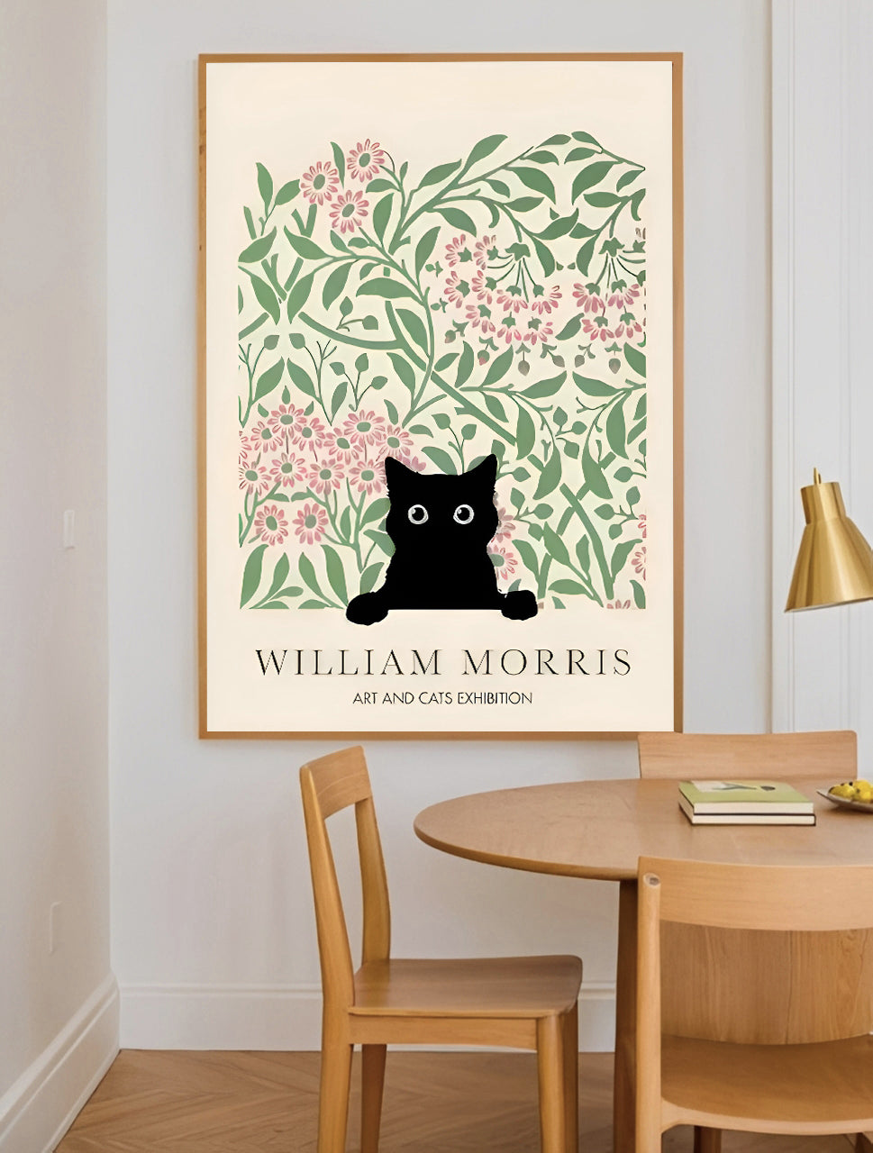 Framed artwork with a black cat art print with floral design on a wall above a wooden table.