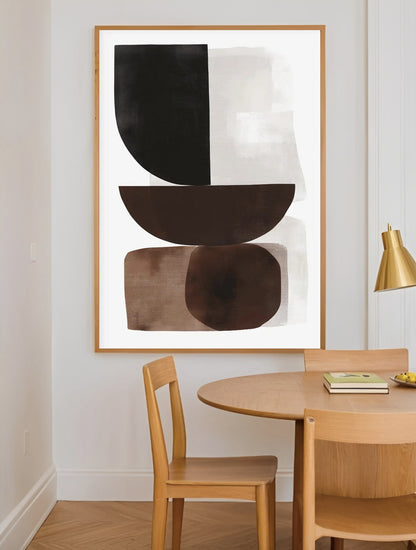 Abstract art piece in a modern dining room with wooden table and chairs.