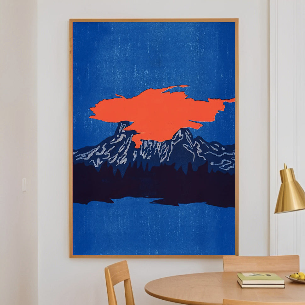 Dining room with a blue wall featuring an abstract orange and white artwork, wooden table, and chairs.