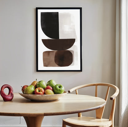 Abstract art print on a wall above a table with fruit and a chair.