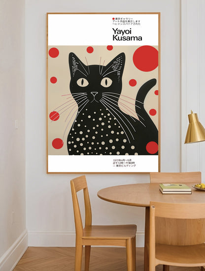 Framed artwork of a black cat with red dots by Yayoi Kusama in a dining room.