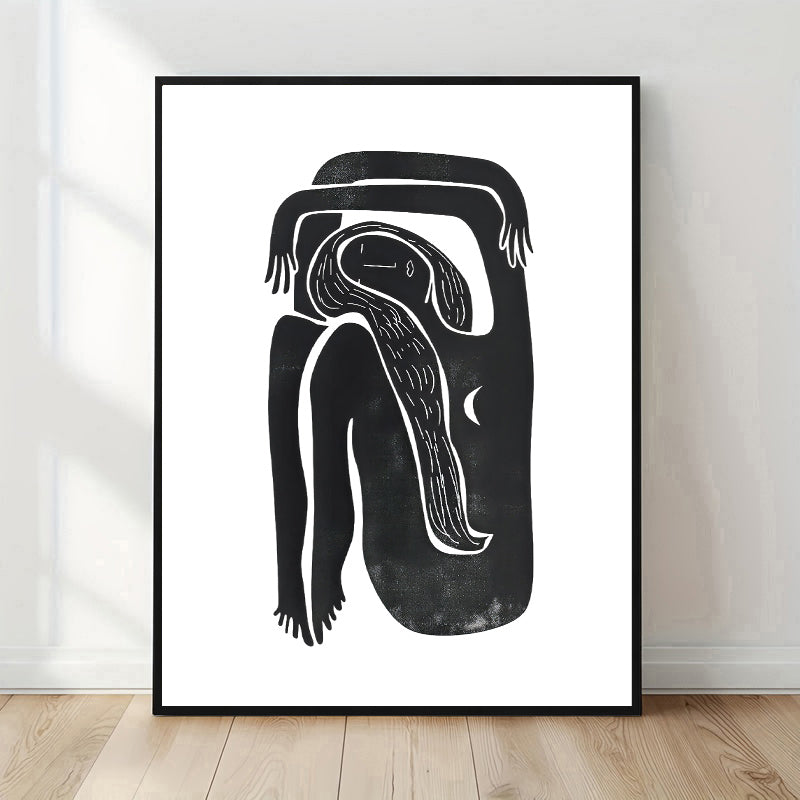 Framed black and white abstract artwork on a white wall.