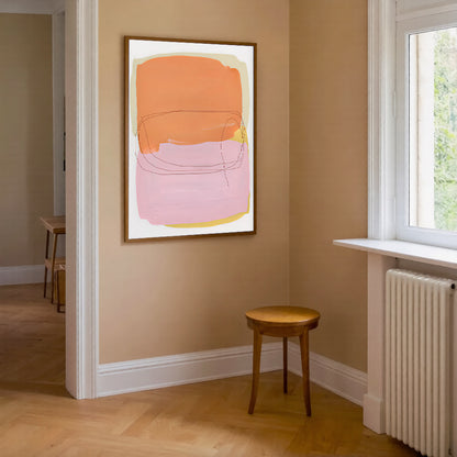 Abstract art piece on a beige wall with a wooden stool and radiator in the foreground.